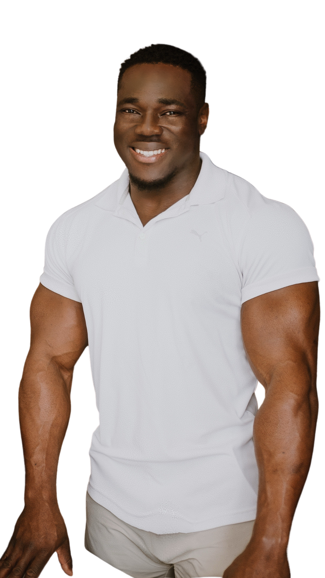 Therapist Edgard smiling in a white polo shirt against a black background