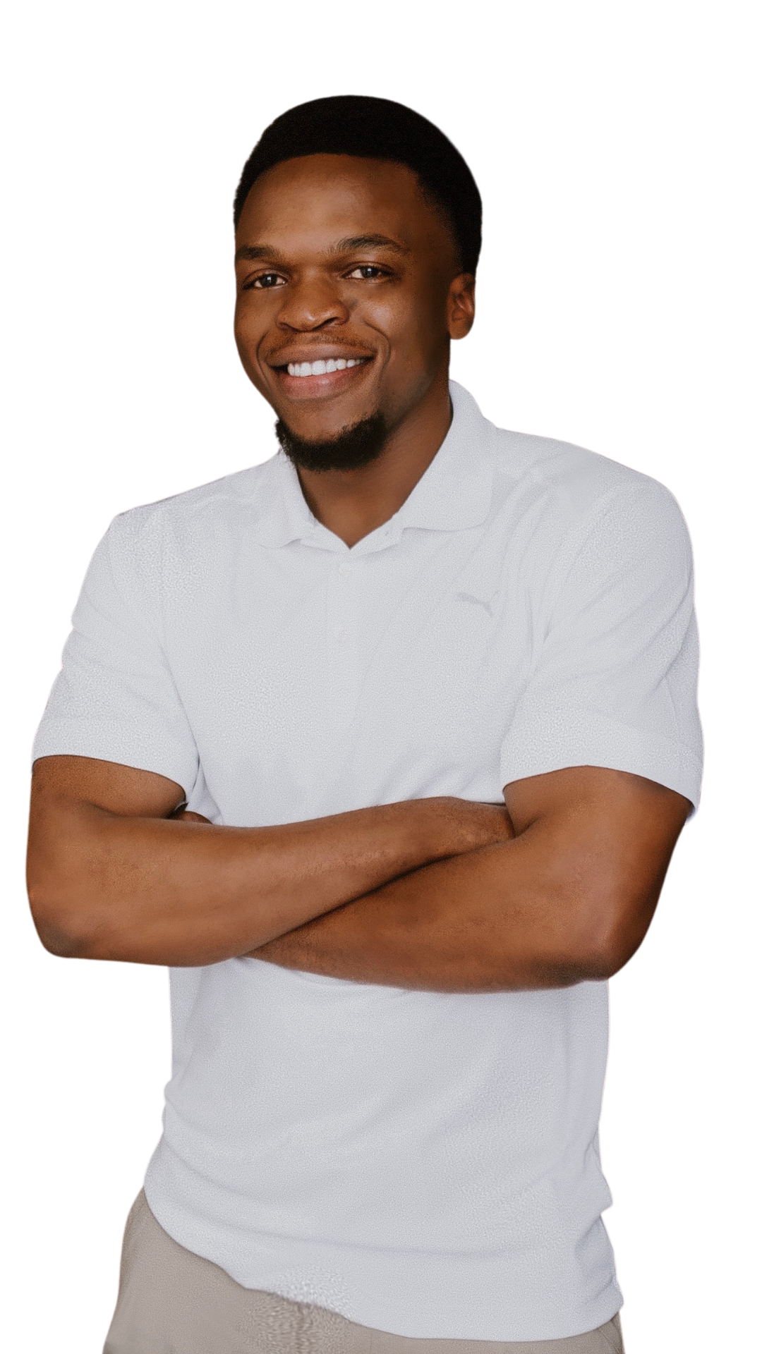 Therapist Caleb smiling with arms crossed, in a white polo shirt against a black background