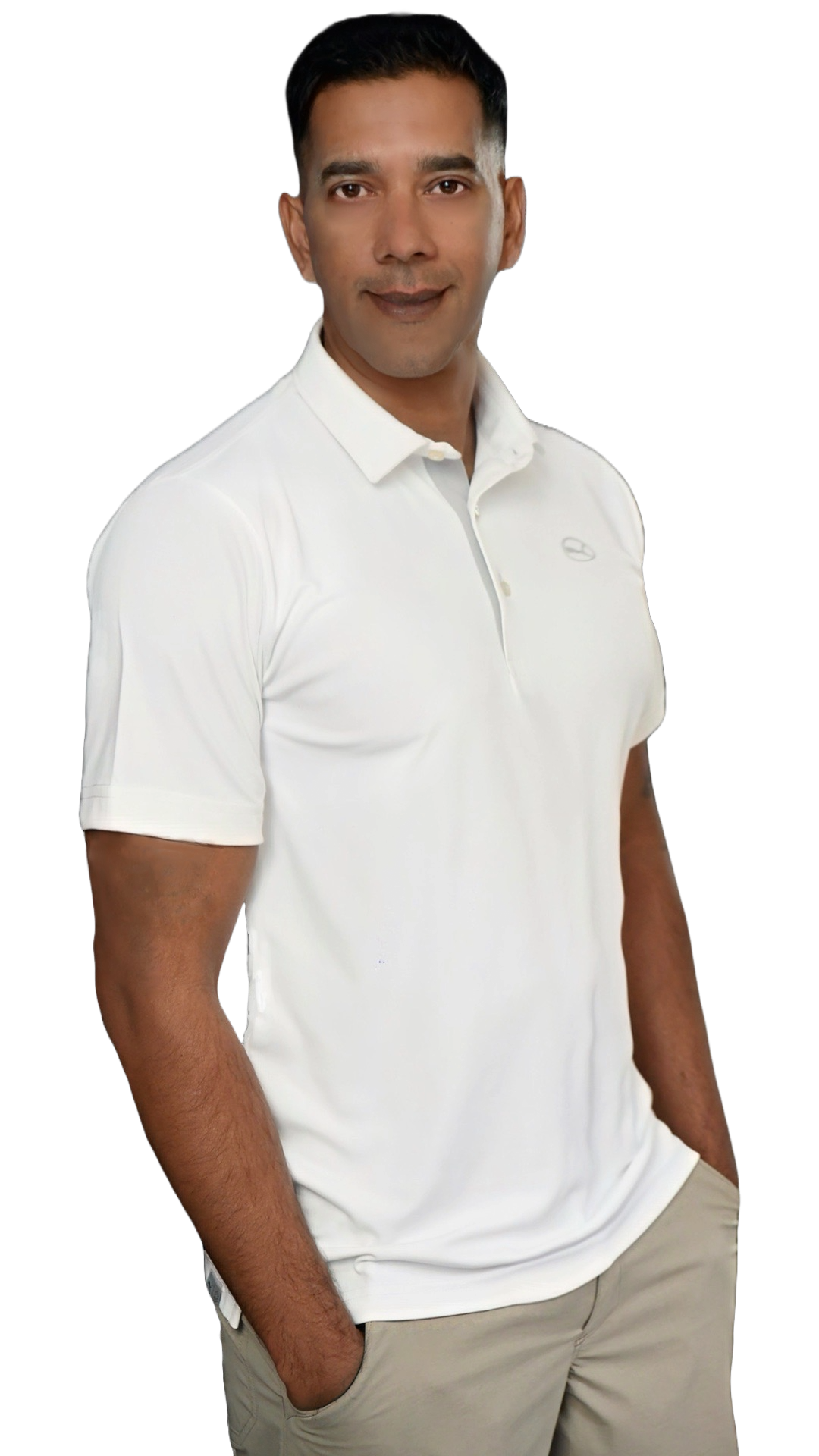 Therapist Neo in a white polo shirt, hands in pockets, against a black background